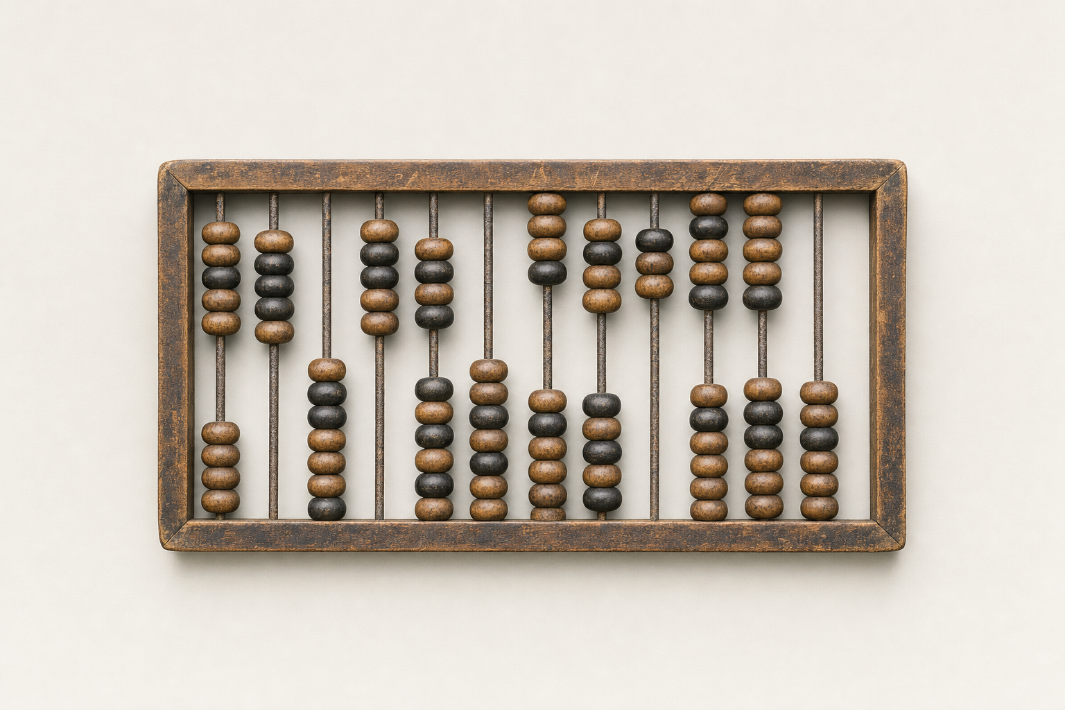 A worn wooden abacus photographed flat from above, its rows of brown and near-black beads pushed into uneven groups along the rods